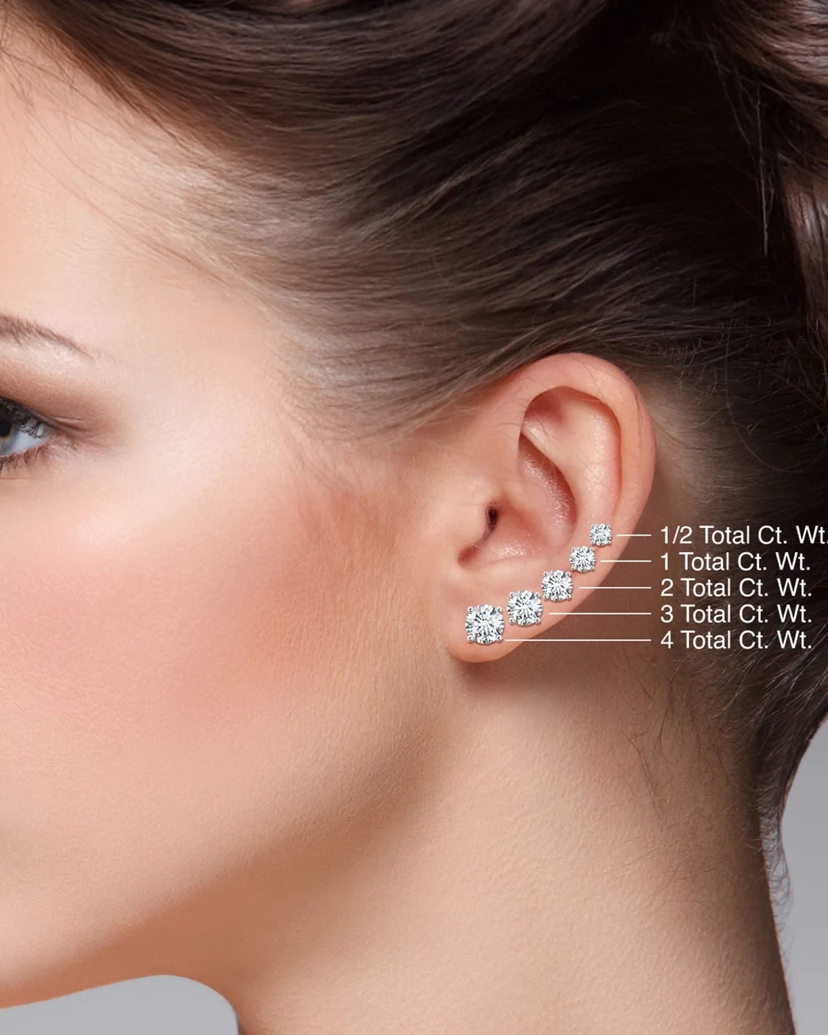 Half a carat through to four carats, shown as studs on the same ear